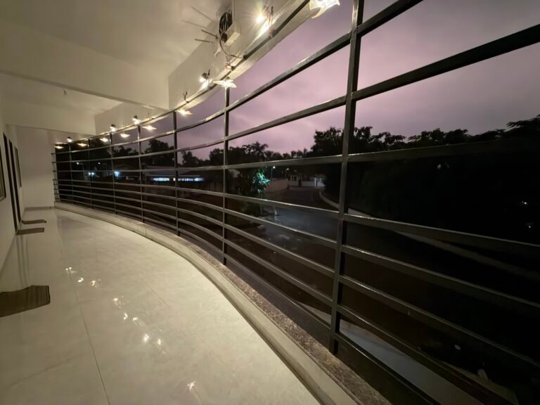 Nandan Villa, Karjat: The curved first-floor balcony at dusk