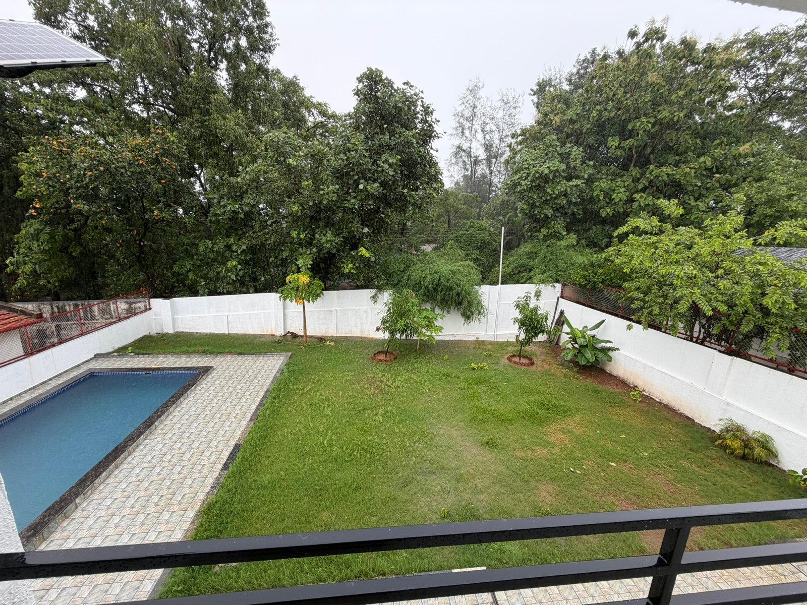 Nandan Villa Karjat, pool and garden from a bedroom balcony